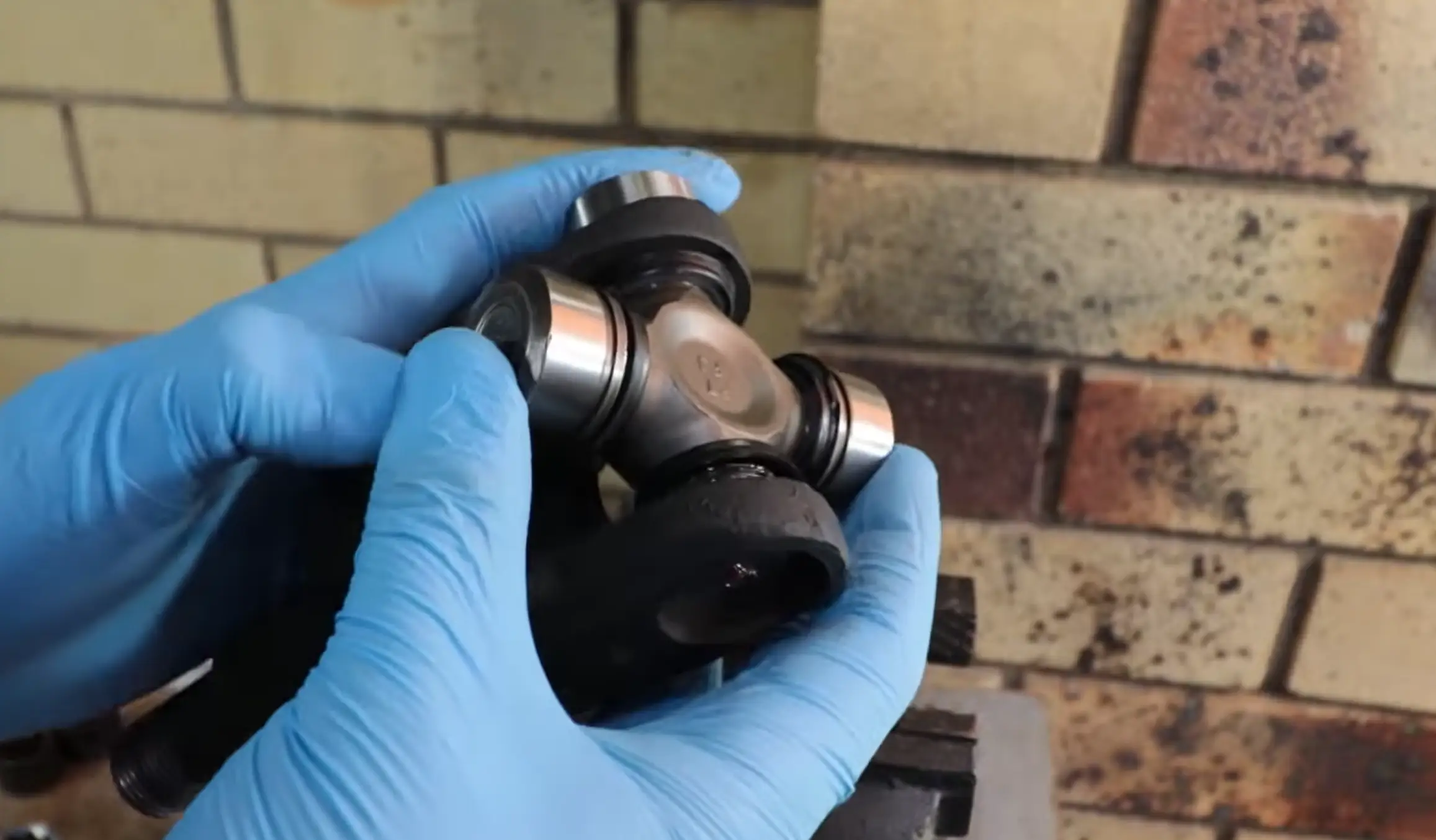 Slide the U-Joint Cross into the Yoke
